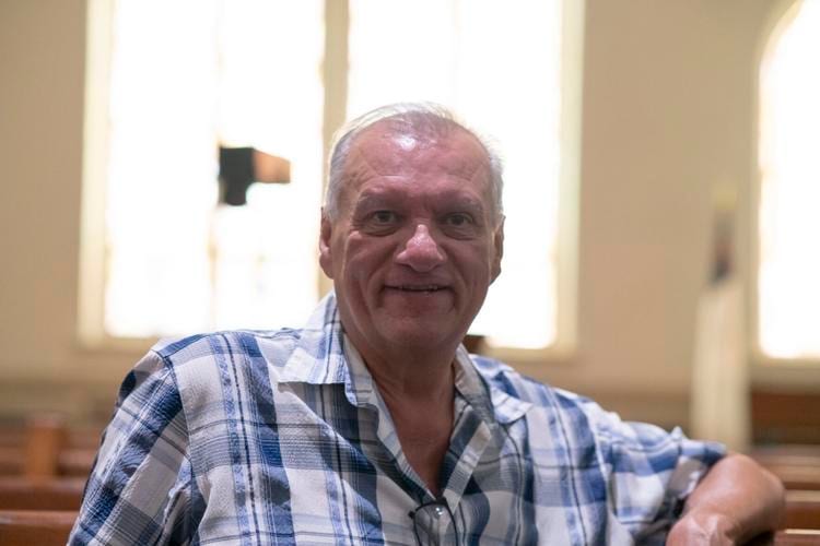 Maury Evans seated inside First Christian Church