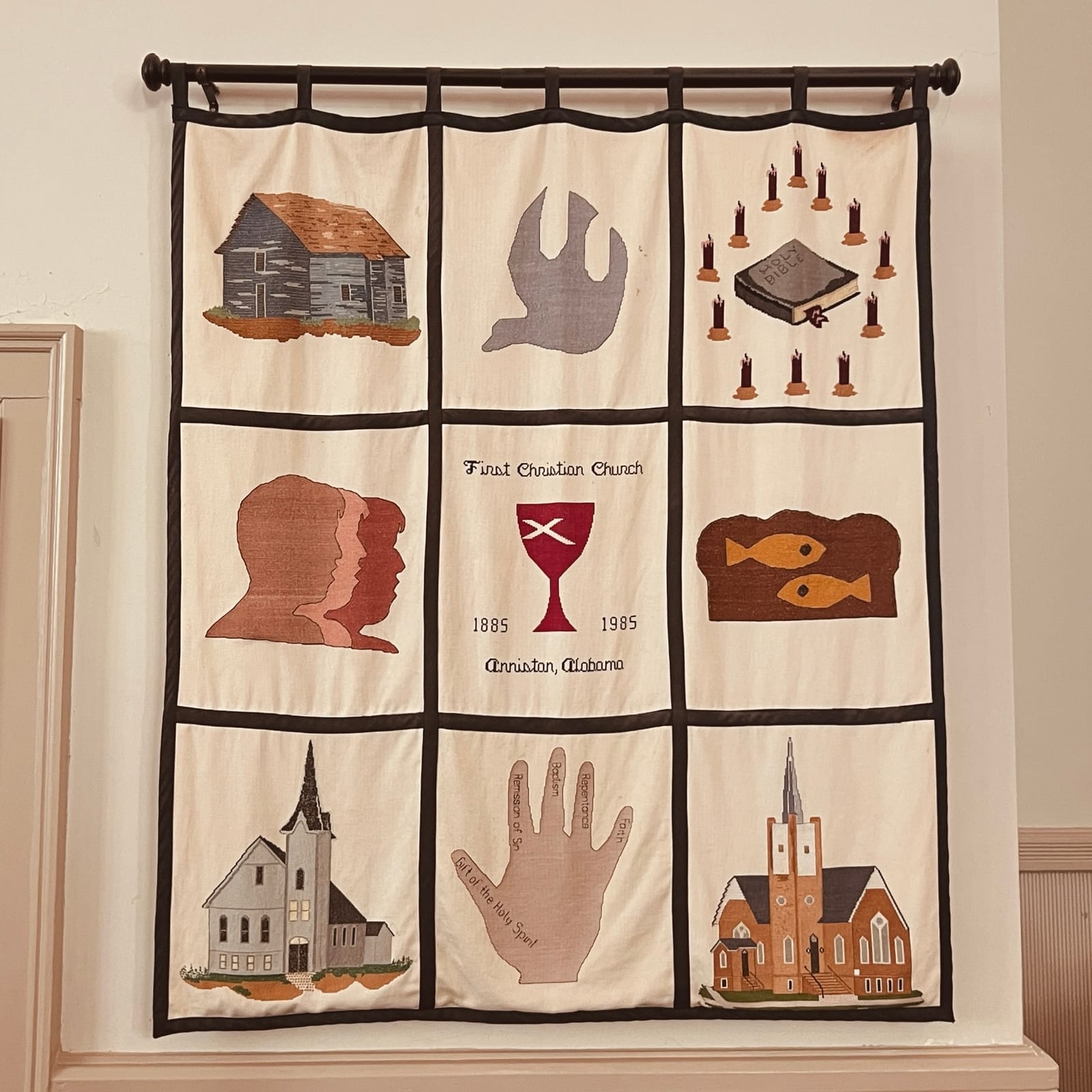 A handmade tapestry illustrating the history and symbols of the church